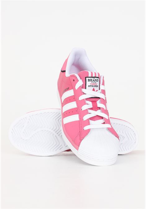 Pink women's sneakers with 3 white SUPERSTAR stripes ADIDAS ORIGINALS | IE0863.